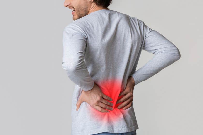 A man struggles with agonising back pain